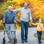 Father walking with adult son and grandson