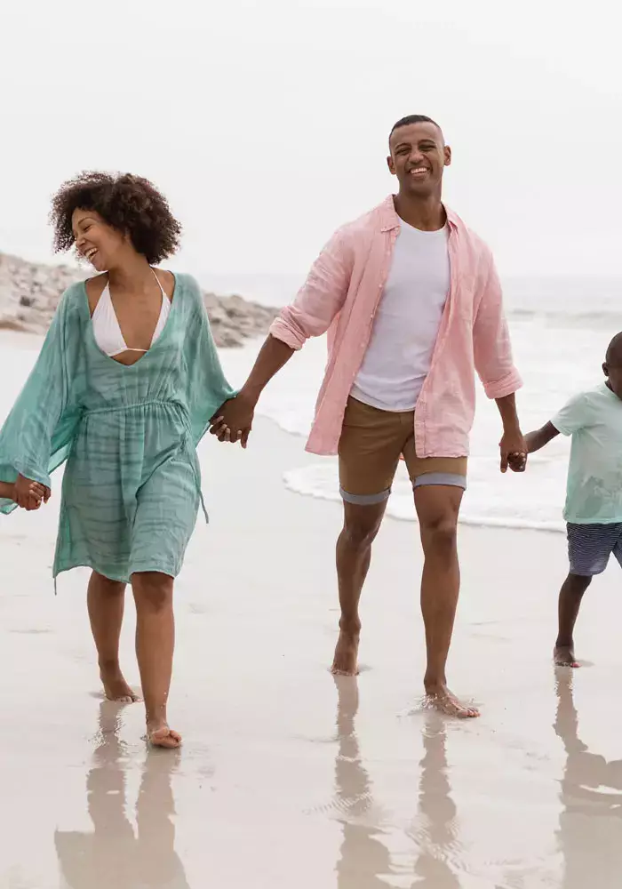 Family walking on the beach