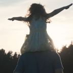 Daughter on Fatherhood shoulders