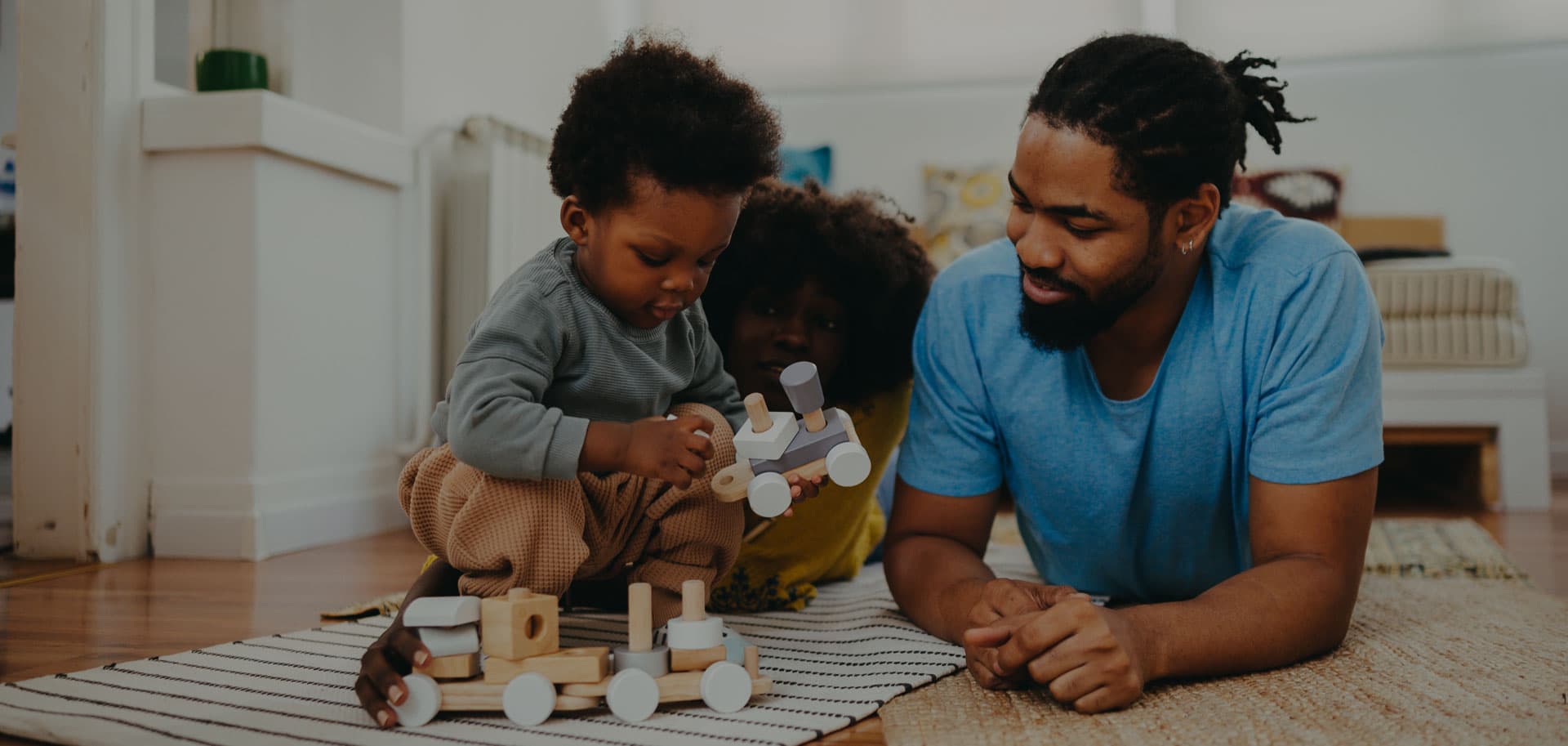 Young family playing with child